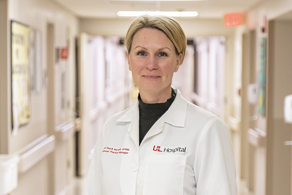 Photo of Dr. Jodi Wojcik Marshall in white lab coat
