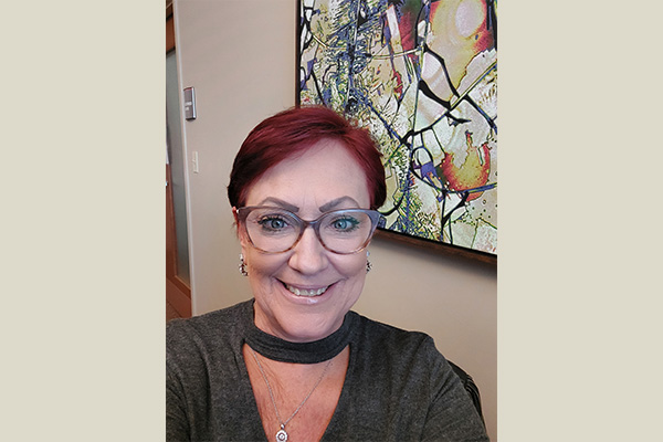 Brown background – Non-intranet Photo of Lori Woods