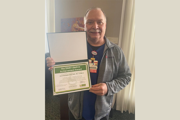 Jack B DAISY Lifetime Achievement Award Winner Feb 2022 Jack Boniakowski smiles while holding his DAISY Lifetime Achievement Award, Winner Feb. 2022